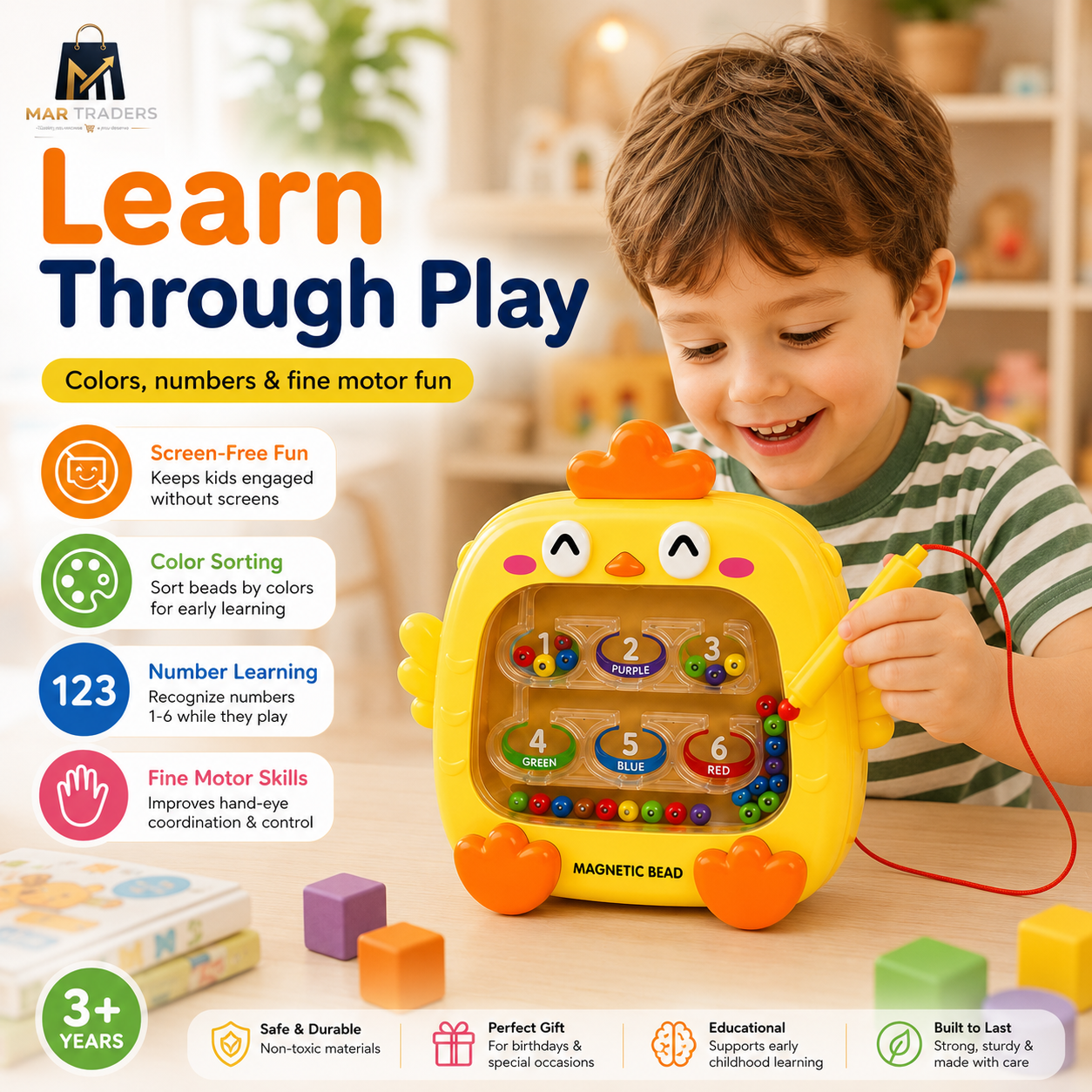 A young boy in a green striped shirt plays with a yellow magnetic bead toy shaped like a chick on a wooden table. The toy has colorful magnetic beads and a red pointer.