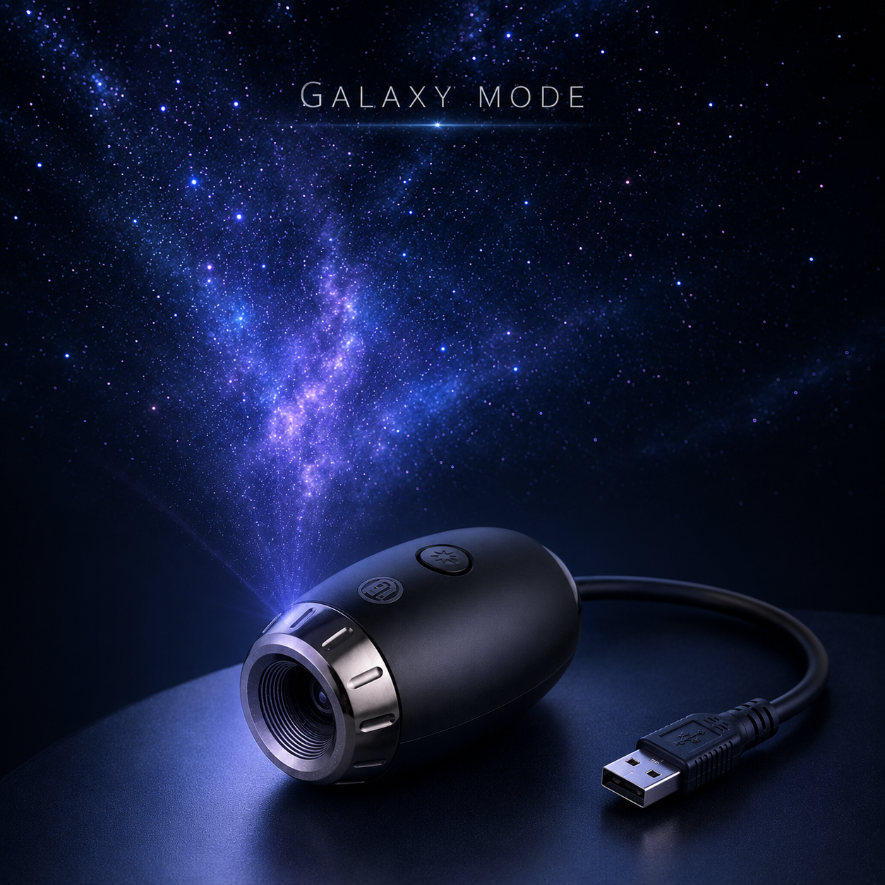 A black USB projector labeled 'GALAXY MODE' casting a blue-purple galaxy projection onto a dark surface, with a visible USB cable and starry space background.